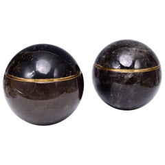 Group of Two Dark Brown Rock Crystal Globes with Covers
