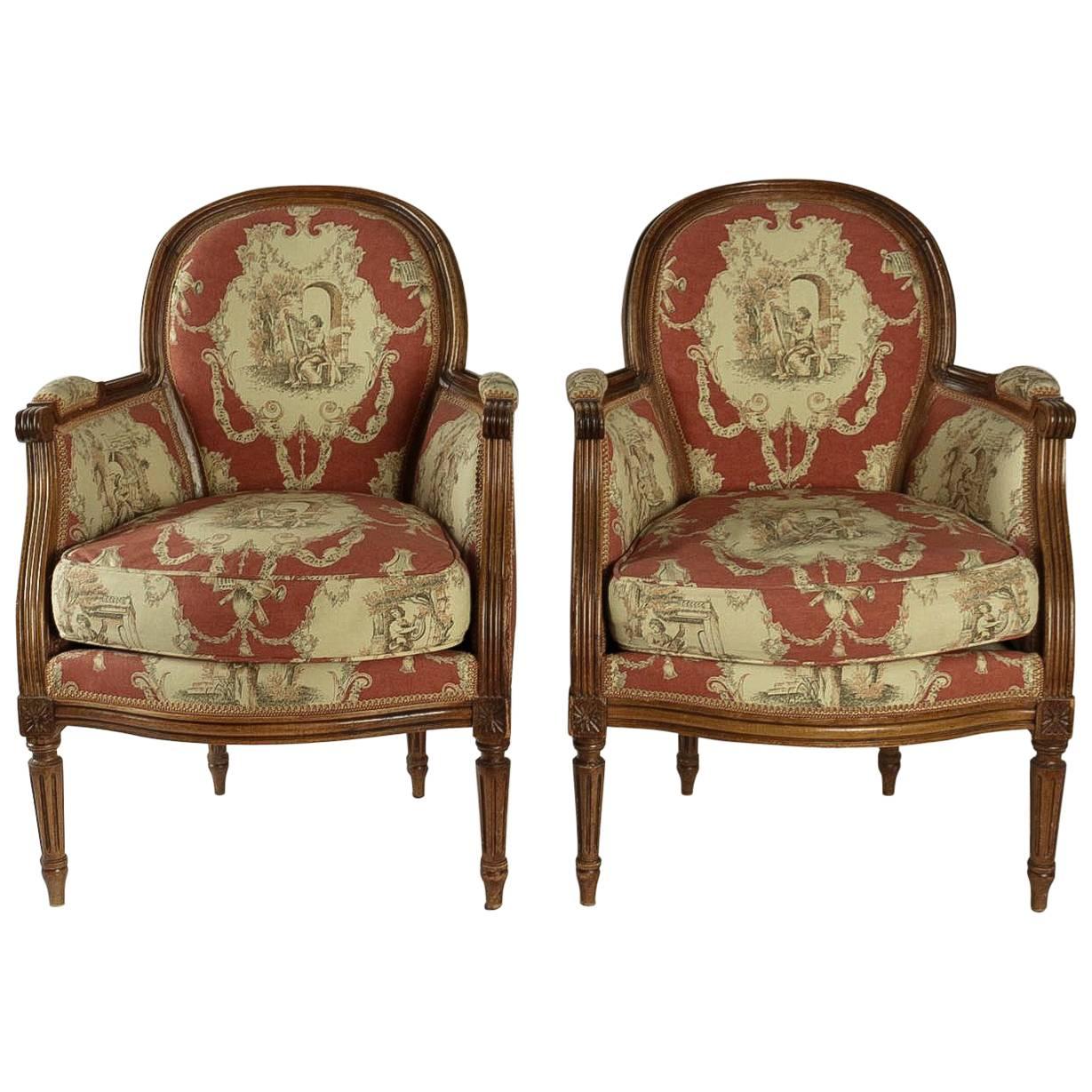 Pair of French 19th Century, Louis XVI Style Fruitwood Bergeres For Sale