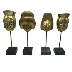 1960s, Italian Modern Brass Asian Mask Sculptures on Marble Base, Set of Four