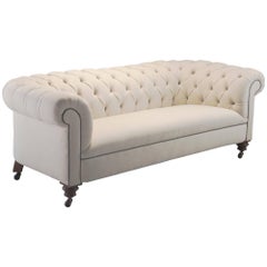 Late 19th Century Chesterfield Sofa with Turned Mahogany Legs and New Upholstery