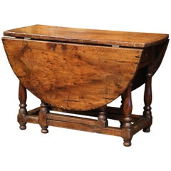 18th Century French Carved Walnut Eight-Leg Oval Drop-Leaf Table with Drawer