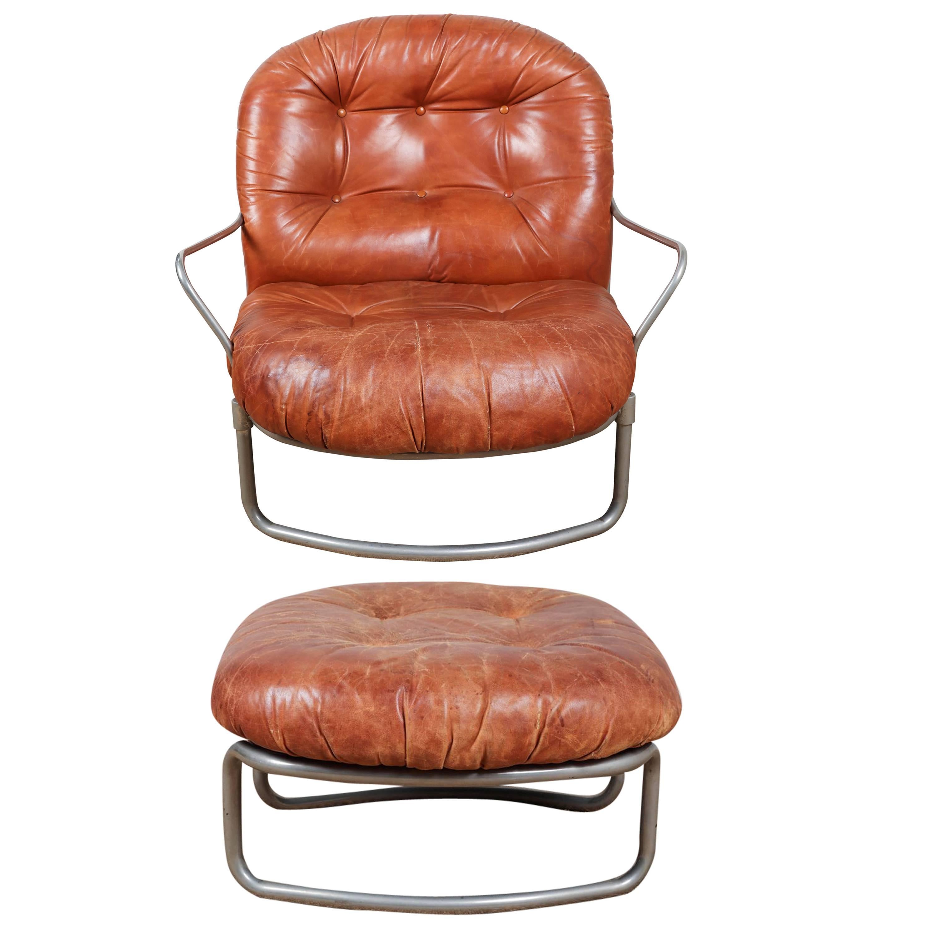 Distressed leather (no rips) and chrome chair and ottoman (25 W x 25 D x 14 H).   Offered by .  