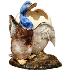 Early 20th Century, French Hand-Painted Barbotine Duck Holding Cracked Egg