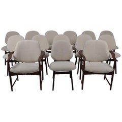 Set of 12 Teak Chairs and Two Armchairs Covered in Sheepskin