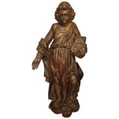 Carved 17th Century French Statue of an Angel Holding a Candlestick