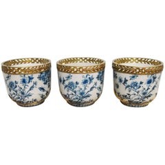 Set of Three Chinese Brass Mounted Blue and White Porcelain Urns