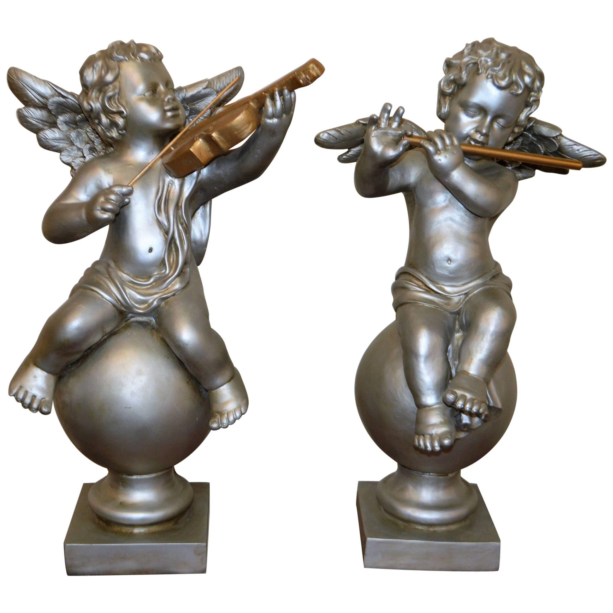Pair of Silver Ornamental Musician Cherub Sculptures