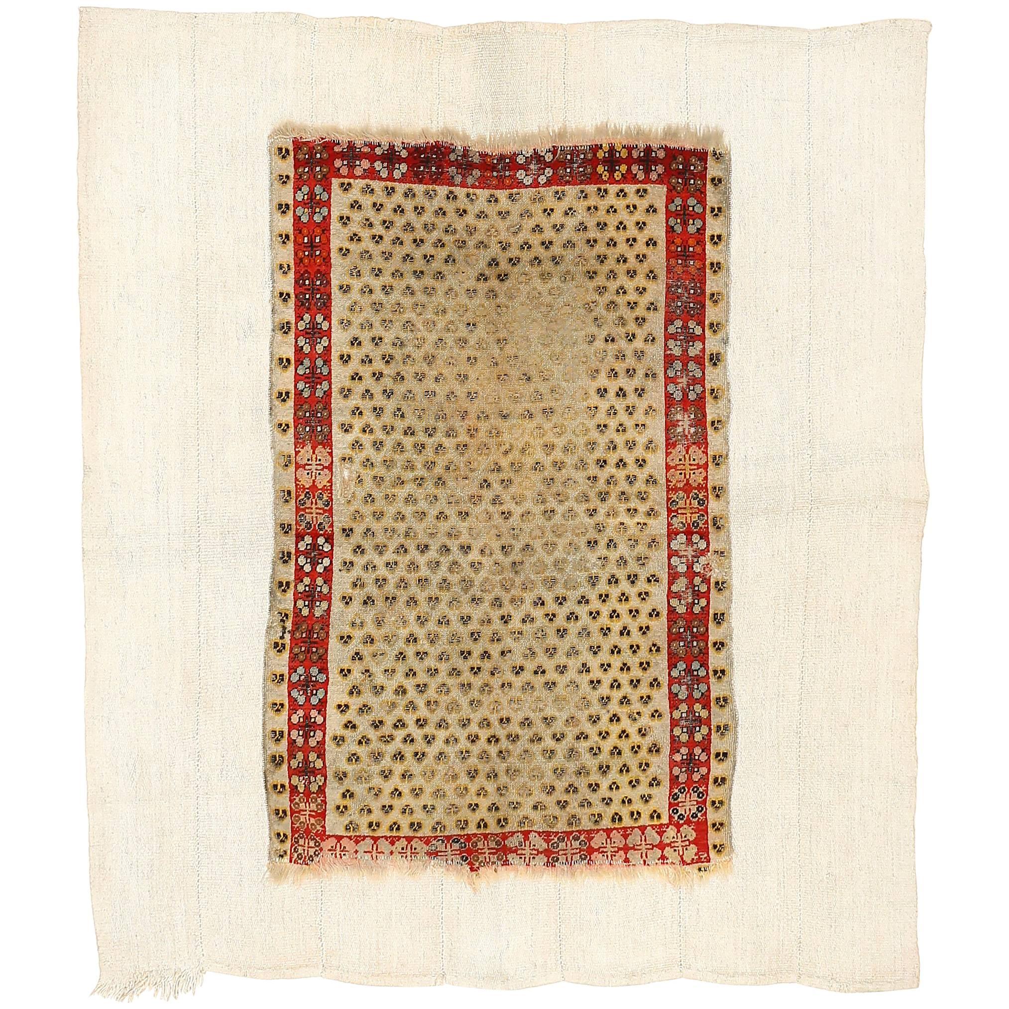Distressed Antique Ghiordes Rug with Cintamani Pattern