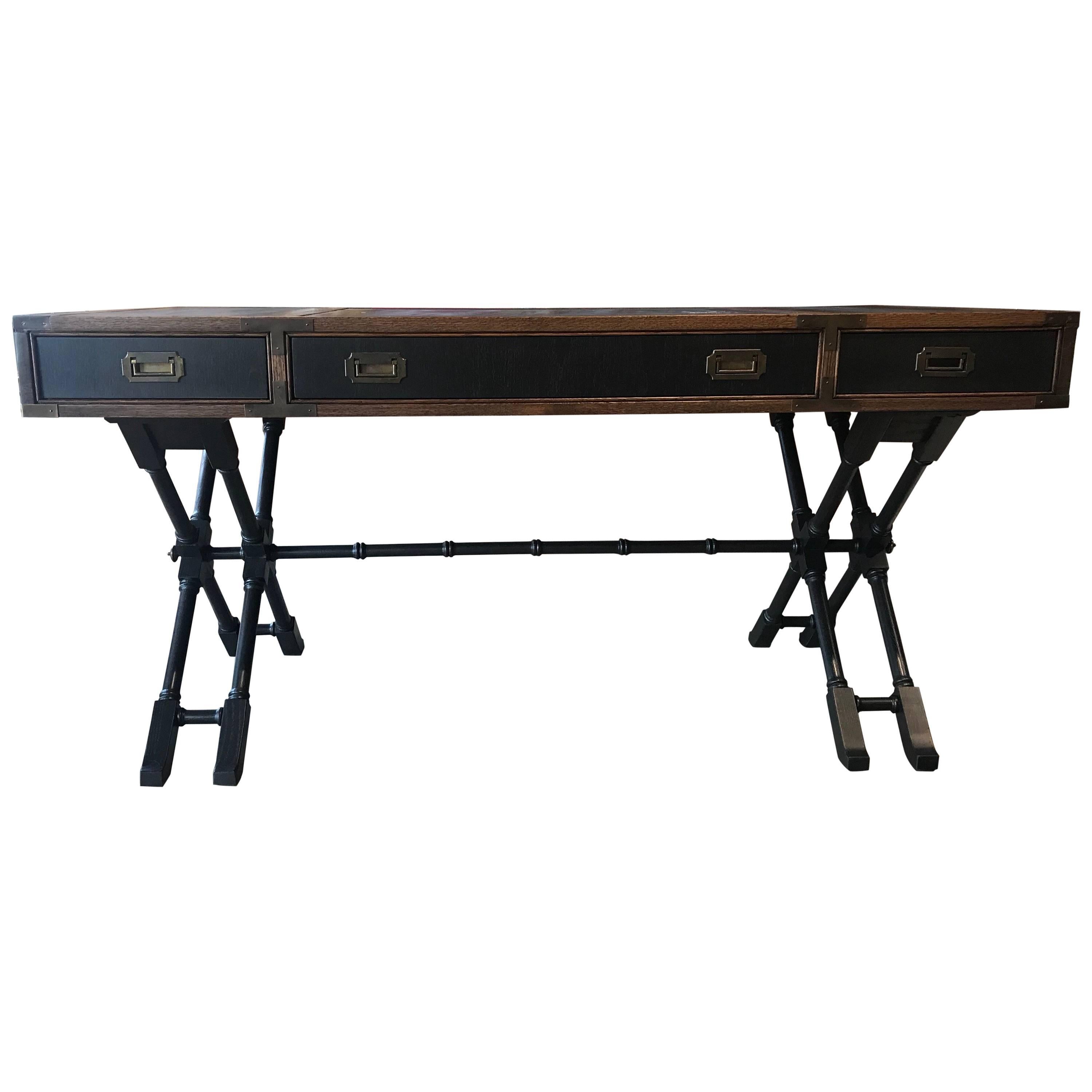 Modern Campaign style faux bamboo desk with leather inserts by Brandt Furniture Co, and attributed to Baker furniture. Outfitted with brass hardware. 