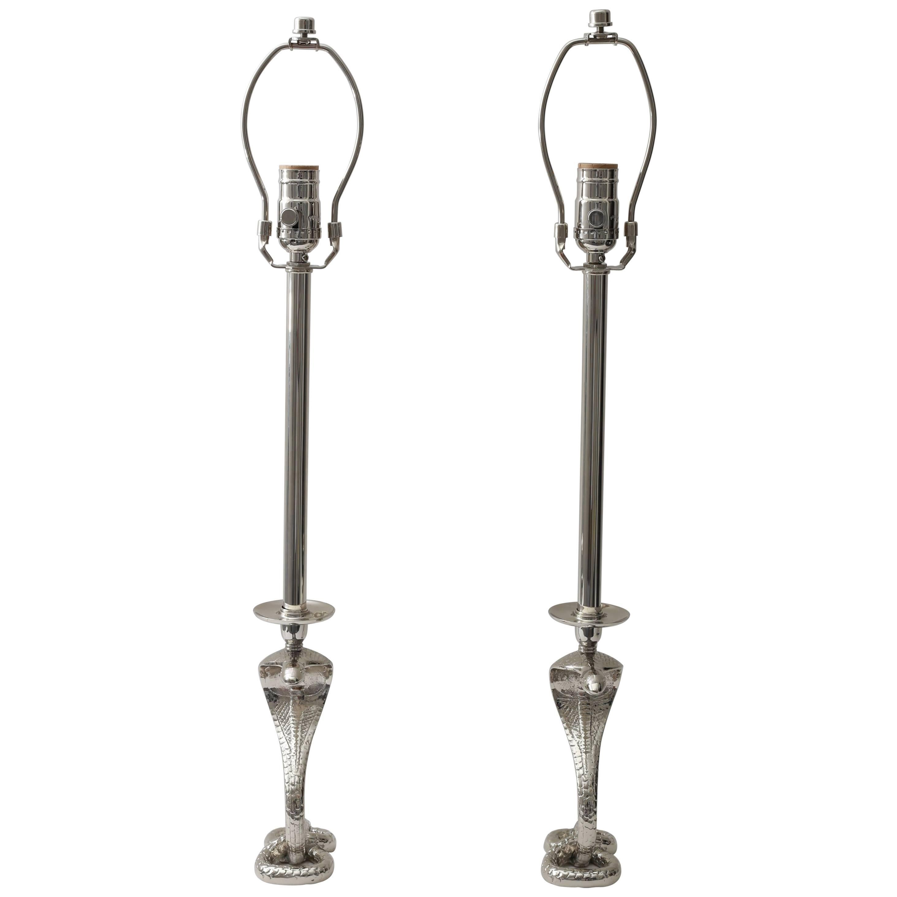 This stylish and chic pair of table lamps are very much the type of pieces coveted by Tony Douquette and will make the perfect statement addition to your home.

The cobras date to Art Deco period and have been nickle-plated and then custom