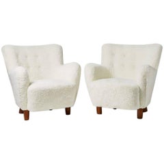 Pair of white sheep skin armchairs, Anonymous, Denmark, 1940s