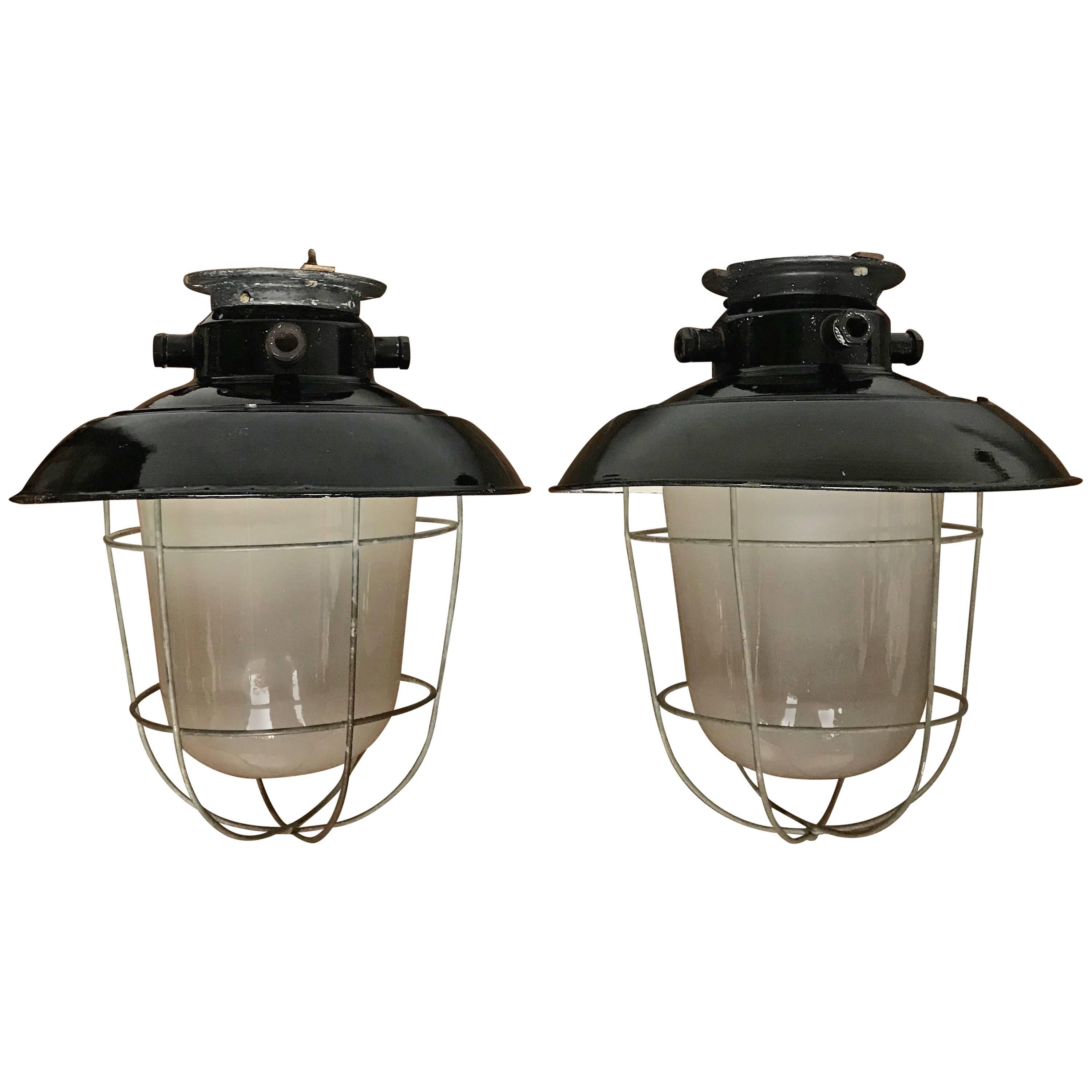 1920s Matching Pair of Industrial, Glass & Black Enamel Caged Light Pendant For Sale