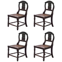 Set of Four 19th Century Ebonized and Carved Wood Chinese Dragon Dining Chairs