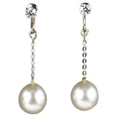 Pair of Diamond and Pearl Drop Earrings Set in White Gold
