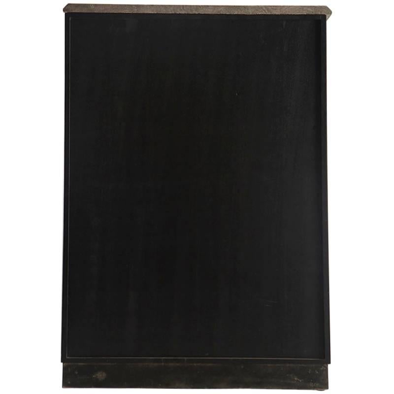 Italian two-door cabinet has wood base that is clad in black Murano glass on front and sides, circa 1960s. Handsome silver tone metal hardware or handle on doors that open to interior compartment with two adjustable shelves. Topped with richly