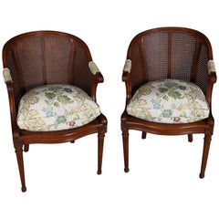 Pair of Antique French Louis XIV Style Carved Fruitwood and Caned Armchairs