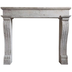 Antique Limestone Fireplace with Cannelure Legs Louis XIV Style