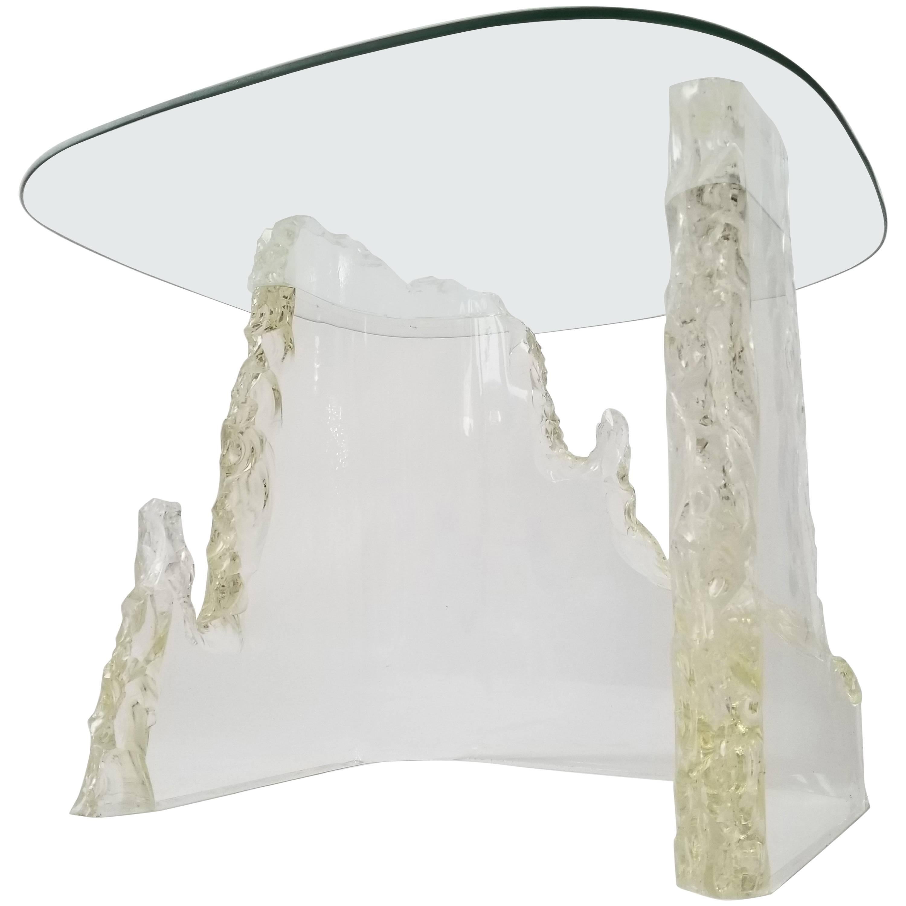 Sculptural side table by Stephen K. Frye for Lion in Frost. 

Solid, 2 inches thick Lucite base. 

Glass top measure 24 x 24 in.

Base measure 19 in. wide x 18 in. deep x 22 in. high. 

 