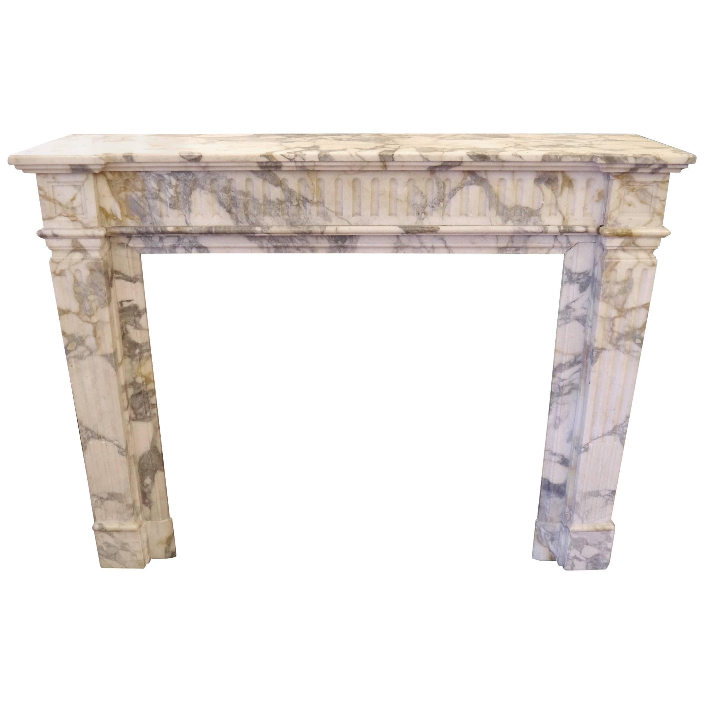 A antique French Louis XVI Breche Blanco Marble fireplace