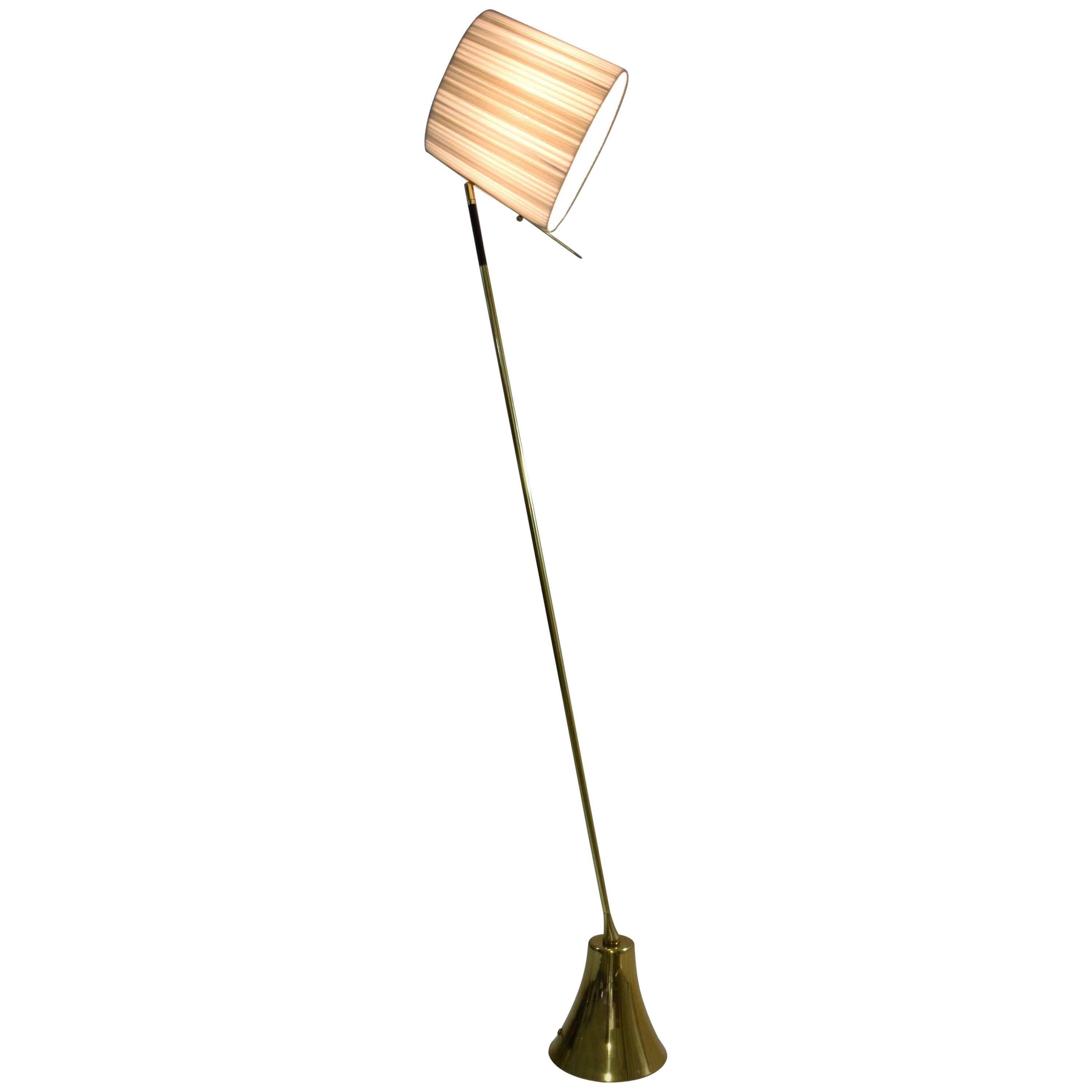 Equilibrium
Definition: when opposite forces are in total harmony 

Contemporary handcrafted floor lamp composed of a thick solid polished brass structure with a hand braided leather design, handcrafted by artisans saddlers, which rotates 360