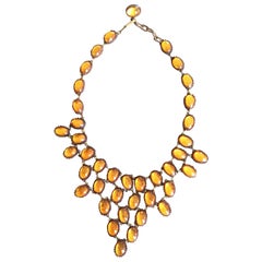 Collier à pompon en ambre miel de Line Vautrin