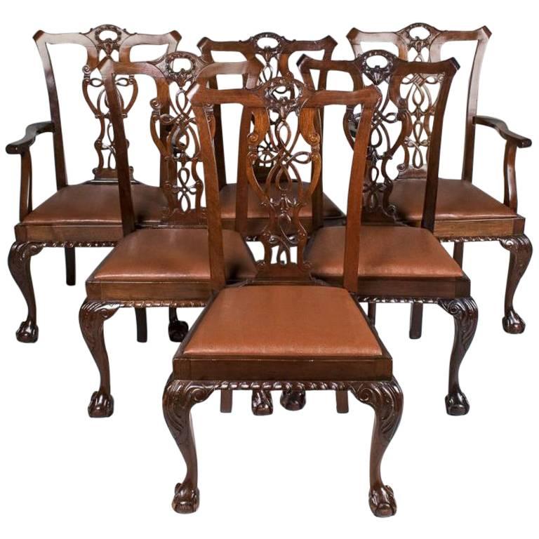 Large Set of 12 Carved Walnut Chippendale Chairs in Georgian Form but of New York 18th Century Style
--Ten side, two arm

Ribbon back chairs with trapezoid seats and cabriole legs ending in claw and ball feet, comprising two armchairs and ten side