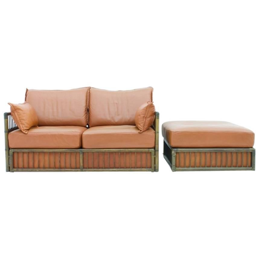 Two Person Leather Sofa and Foot Stool with Rattan For Sale
