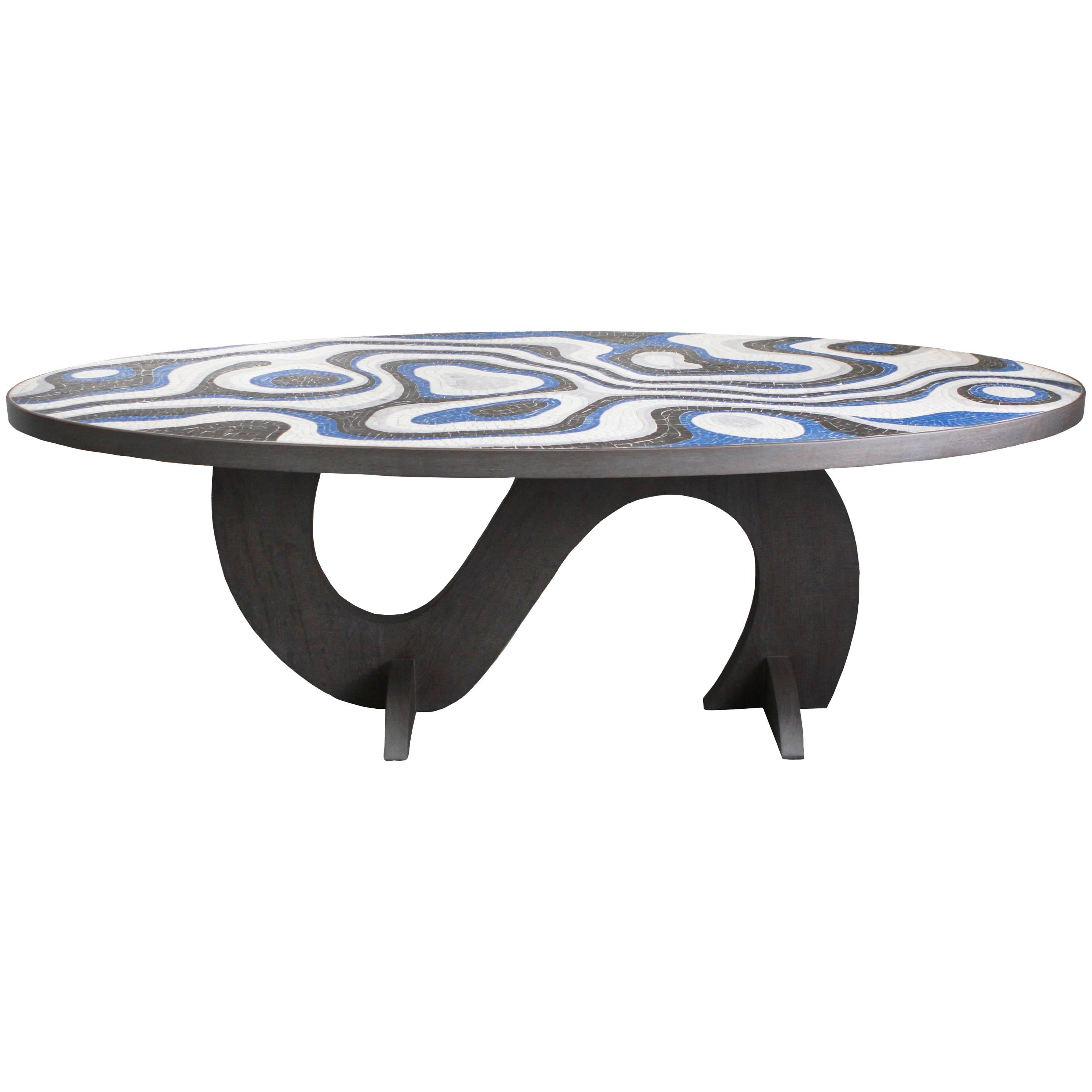 Custom Kelly Behun Studio outdoor dining table with stone mosaic top and teak base.
Mosaic shown is comprised of hand cut Nero Marquina, Carrara, Cristalino and blue quartz.
Custom sizes and mosaic patterns/colors as well as a variety of table base