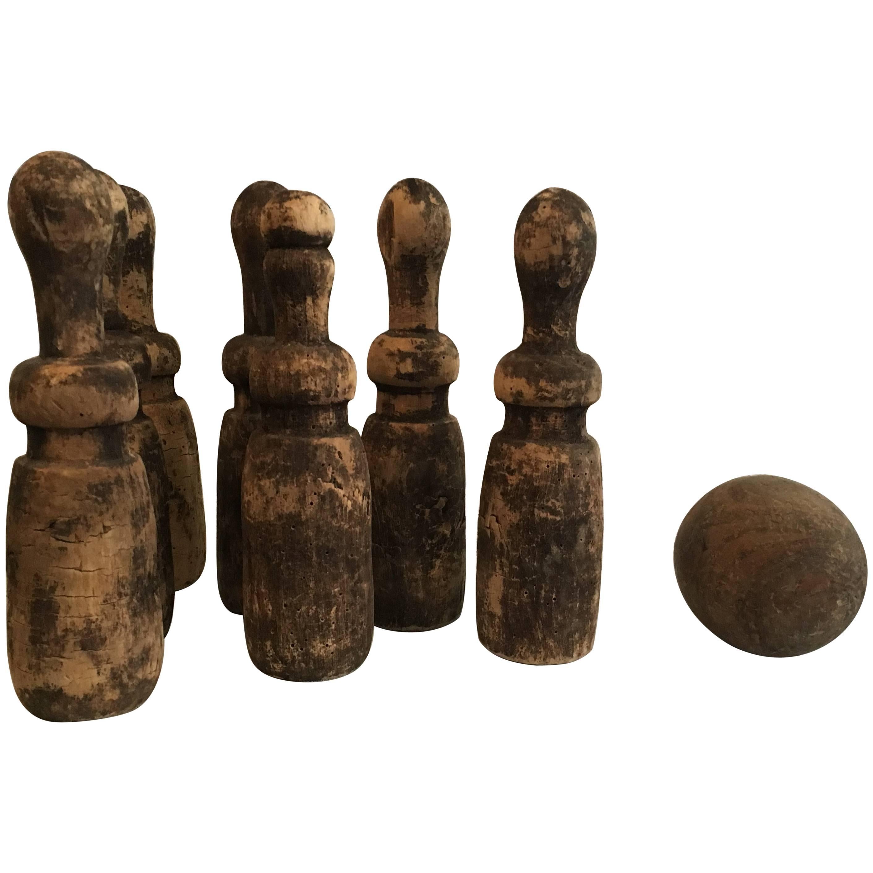 Late 19th Century Weathered Wooden European Complete Seven Pin or Ball Game Set