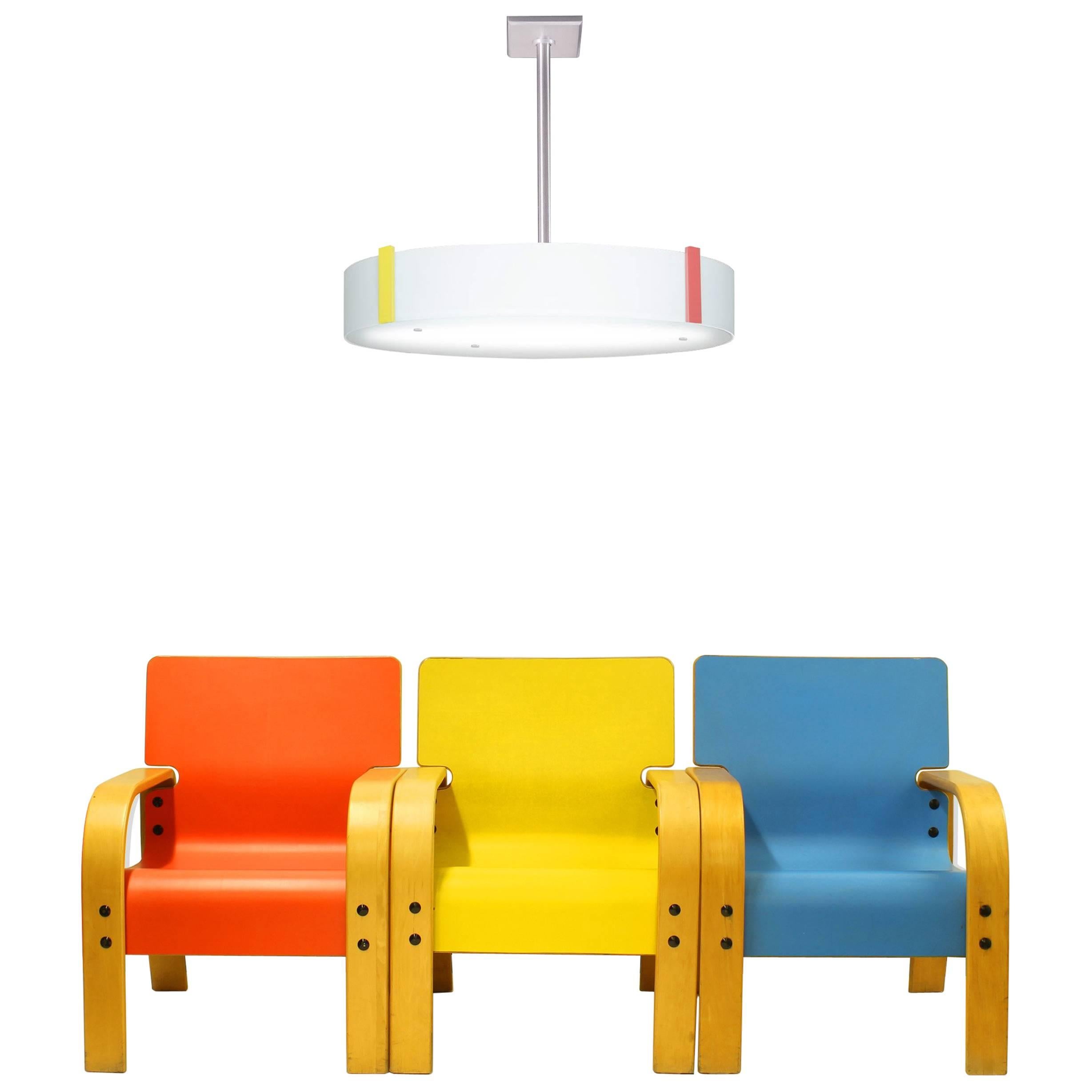 Red, Yellow, Blue Midcentury Armchairs with Duesenberg No. 045 White Glass Drum For Sale