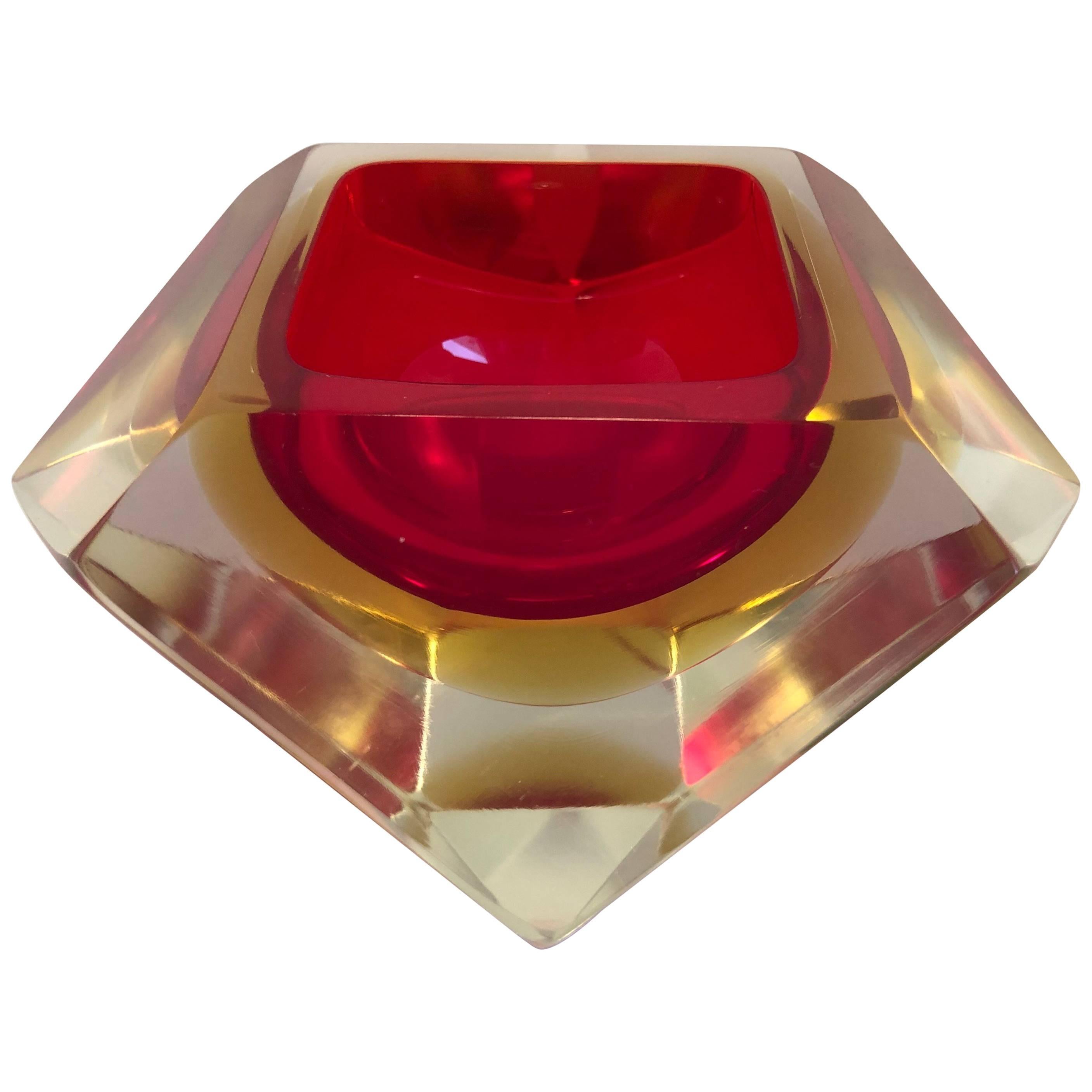 Italian 20th century vintage Murano decorative geode Sommerso bowl by Flavio Poli for Seguso Vetri d'Arte. Designed in a diamond shaped 12 faceted sides in hues of red and yellow. A vibrant piece of art glass to decorate any living space which can