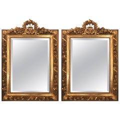 Pair Of Gilt Gesso and Wood Ribbon Tassel Rose Carved Mirrors