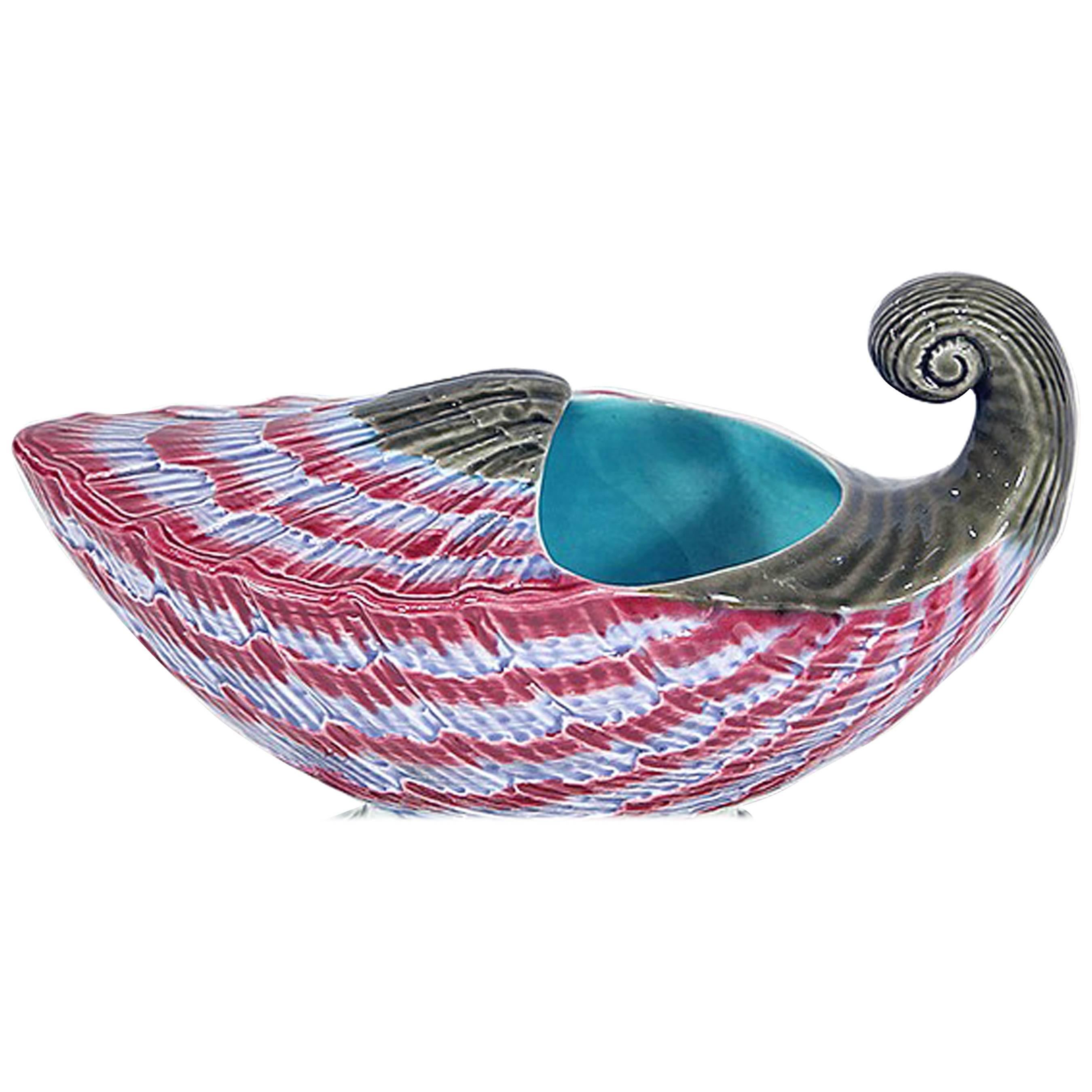 Wedgwood Majolica shell-form spoon warmer,
circa 1872.

The warmer is naturalistically modeled as a large shell in sky blue and amaranth.

Marks: Script in red M2954 and M below also impressed Wedgwood /WOH and (star) to left and S to right.