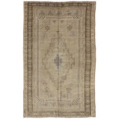 Muted Mid-20th Century Vintage Oushak Rug with Cream-Colored Medallion