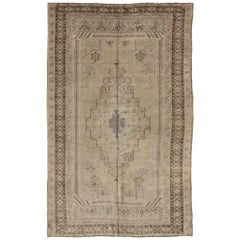 Muted Mid-20th Century Vintage Oushak Rug with Cream-Colored Medallion