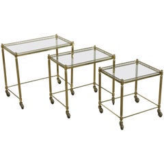 Set of Three Midcentury French Brass and Glass Nesting Tables on Casters