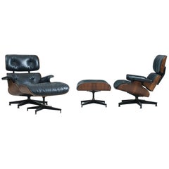 Pair of Vintage Eames 670 Rosewood Lounge Chairs with Ottomans