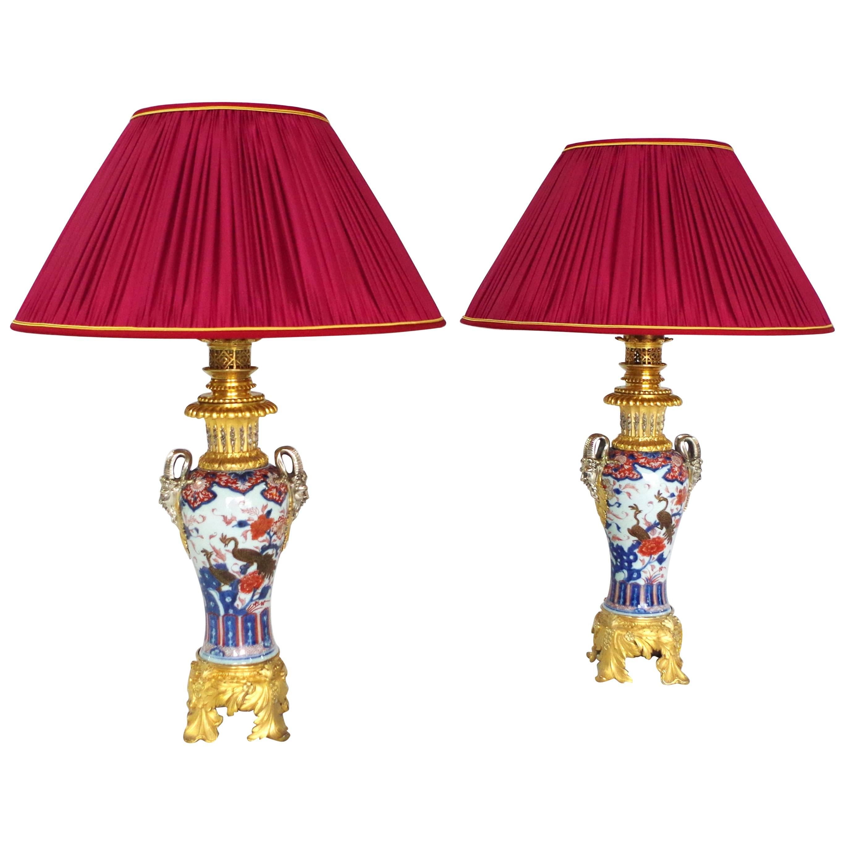 Large pair of Imari porcelain with peacocks lamps, 19th century
