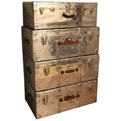 Stack of Four Polished Aluminum Steamer Trunks