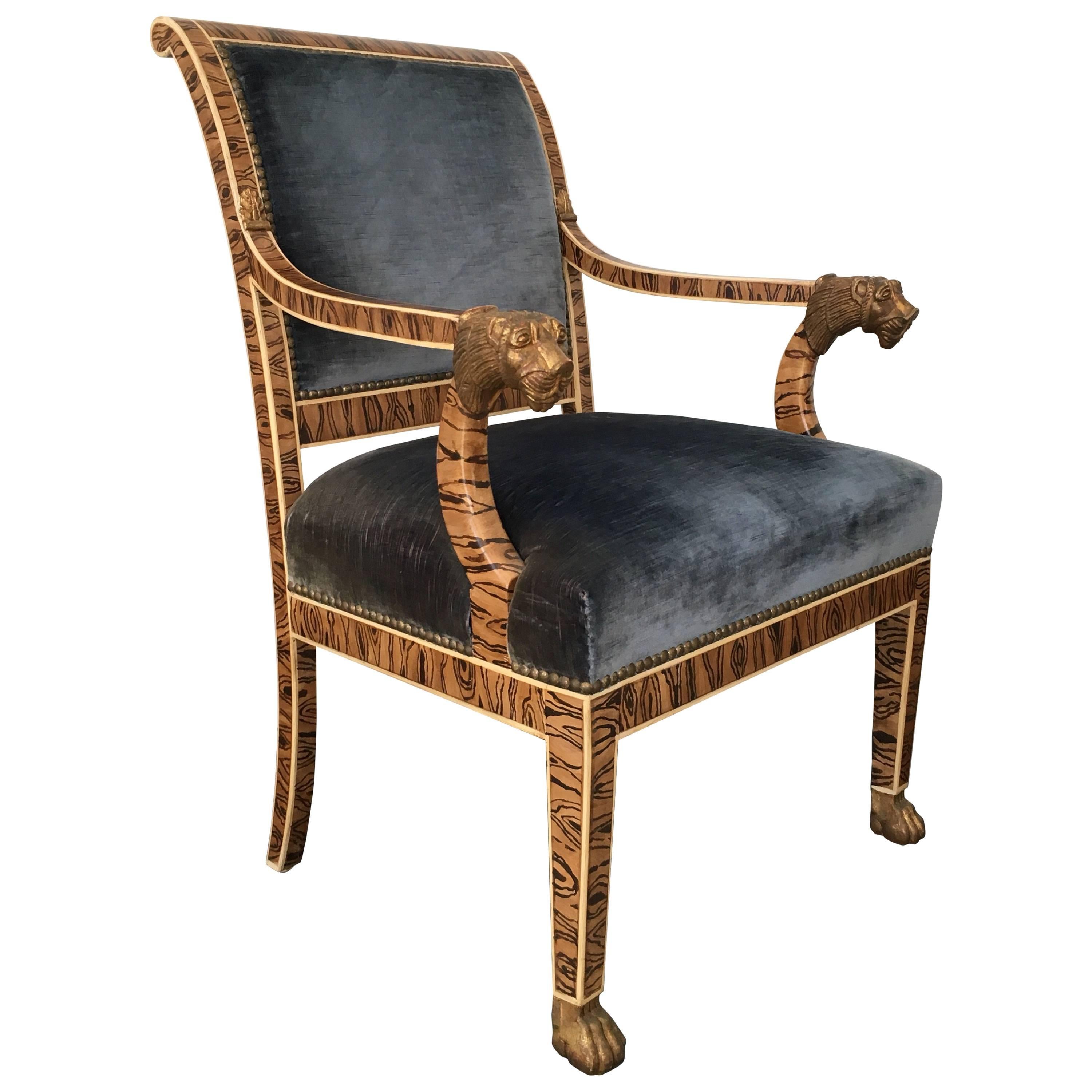 French Empire Style Upholstered Faux Bois Armchair with Gilded Lion Accents