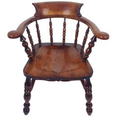 Antique Mid-19th Century English Elm and Fruitwood ‘Smokers Bow’ Elbow Chair