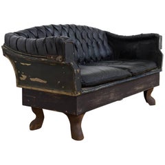 Antique Small Buttoned Black Leather Carriage Sofa on Cast Iron Legs