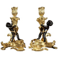 Pair of Gilt and Patinated Bronze Candlesticks after a Model by Meissonnier