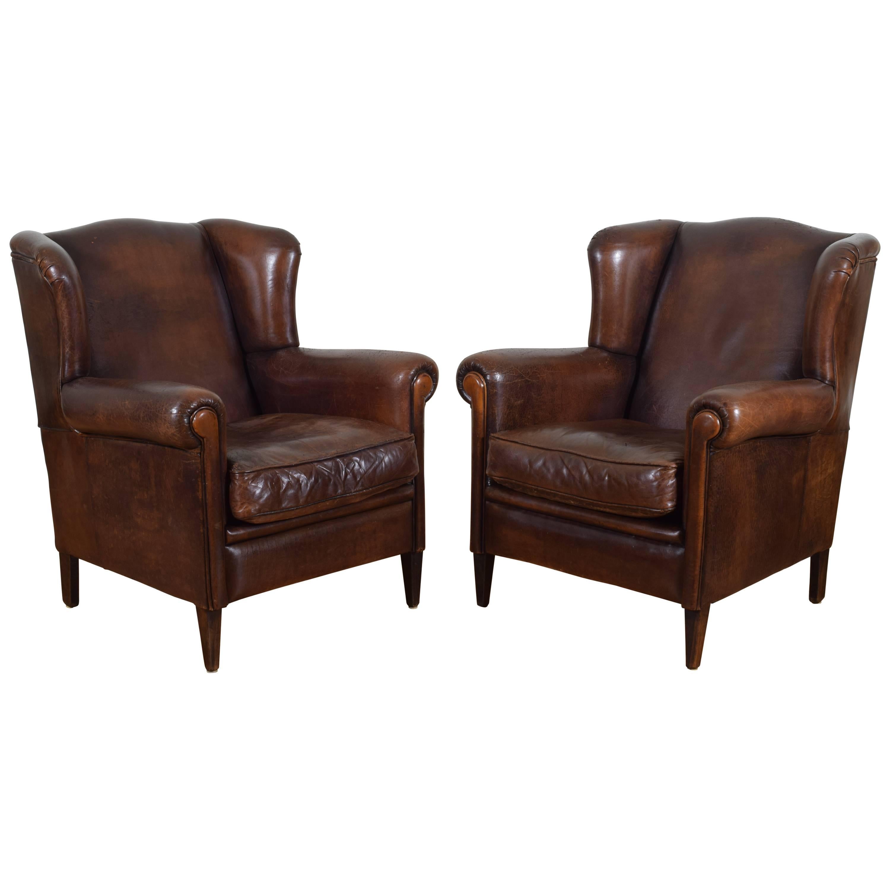 Pair of English Leather Upholstered Wingchairs with Piping, circa 1940s