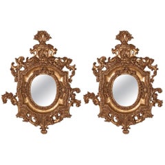 Pair of Ornate Oval Mirrors Hand-Carved Wood Finished in Aged Gold Leaf
