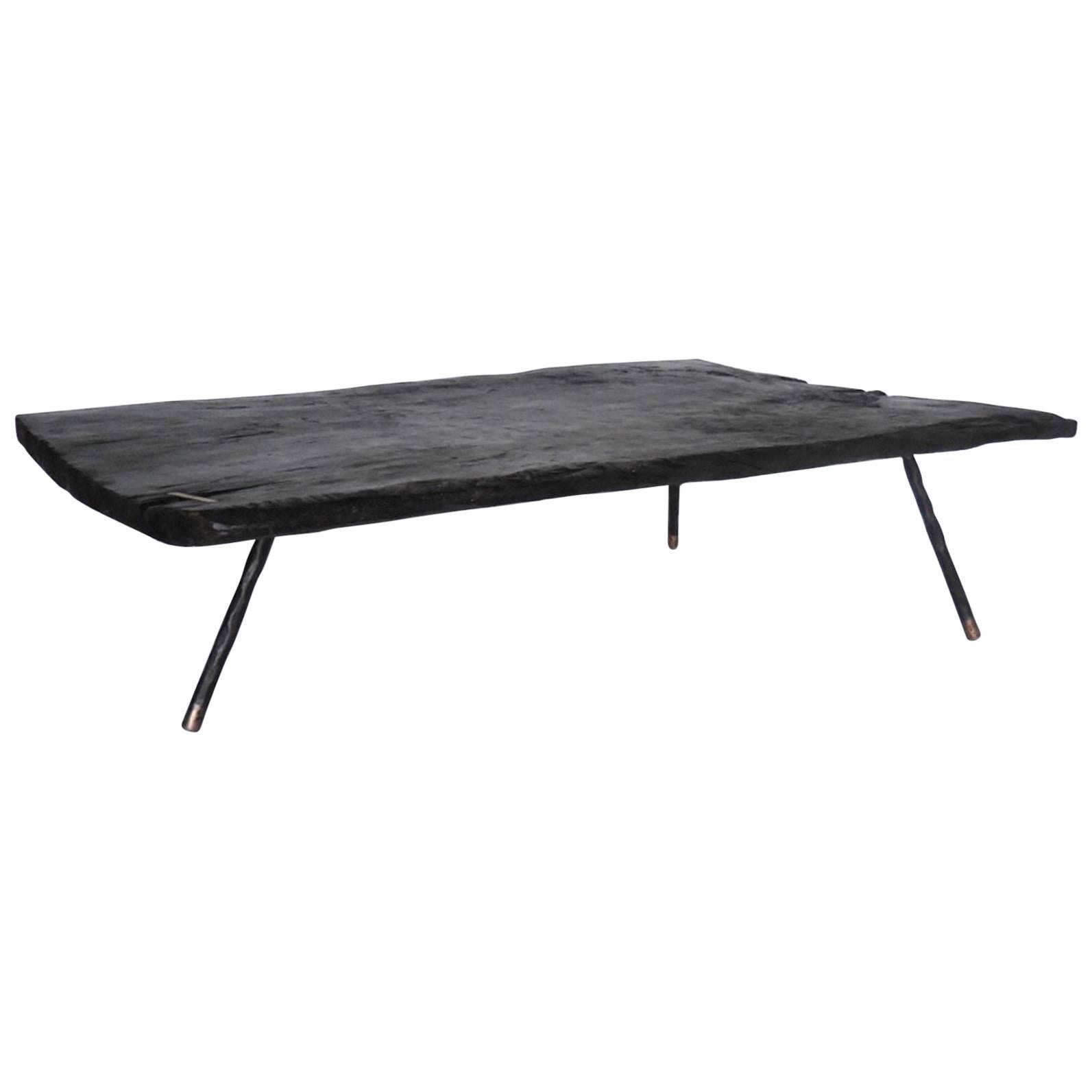 Wide Plank Ebonized Coffee Table with Three Iron and Bronze Legs