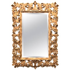 Heavily Carved French Frame Flanking a Bevelled Glass Wall or Console Mirror