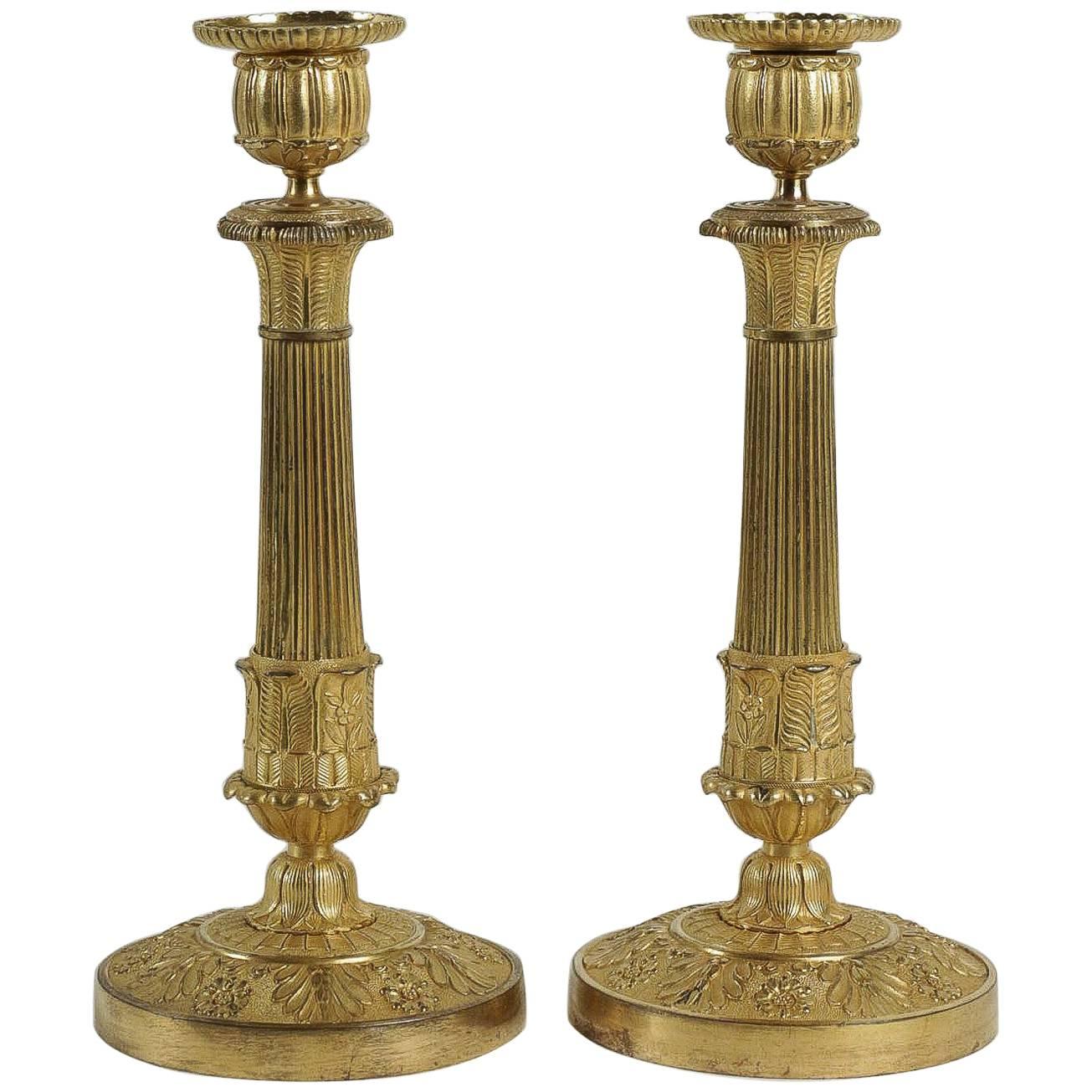 French Empire Period, Pair of Chiseled Ormolu Candlesticks, circa 1810