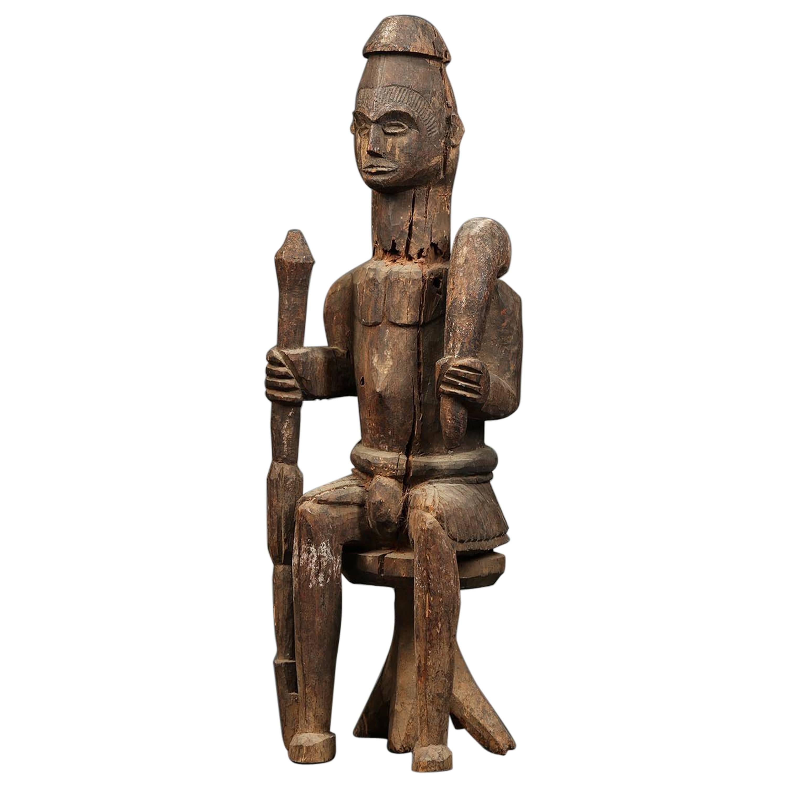 Large Tribal Seated Igbo Ikenga Figure with Sword, Early 20th Century, Nigeria