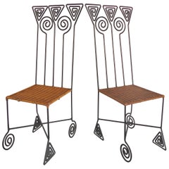 Sculptural Pair of High Back Wrought iron Chairs with Woven Seats